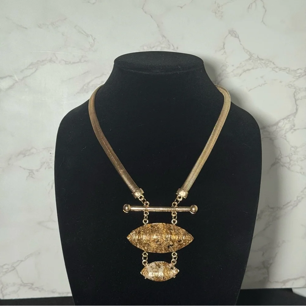 Elegant Gold Necklace with Textured Pendants